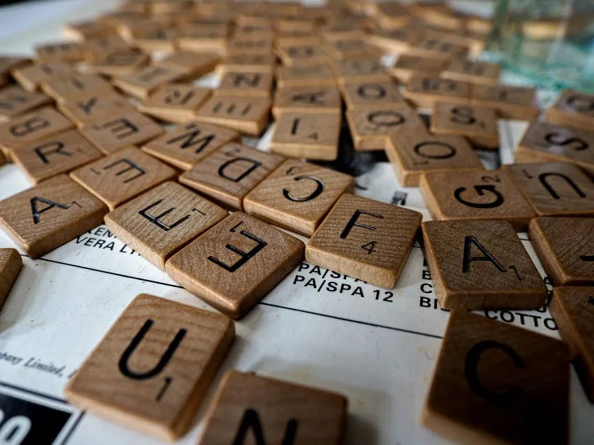 Word sorting activity with coloured letter tiles being dragged into two columns